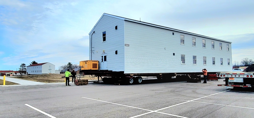 Contractors move third World War II-era barracks to new location