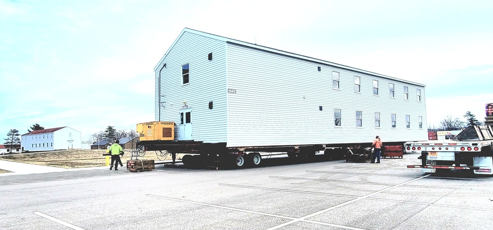 Contractors move third World War II-era barracks to new location