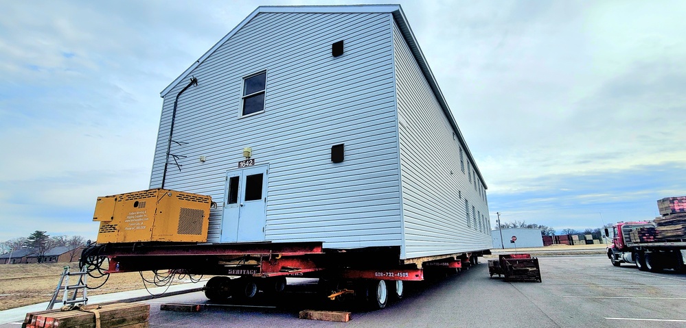 Contractors move third World War II-era barracks to new location