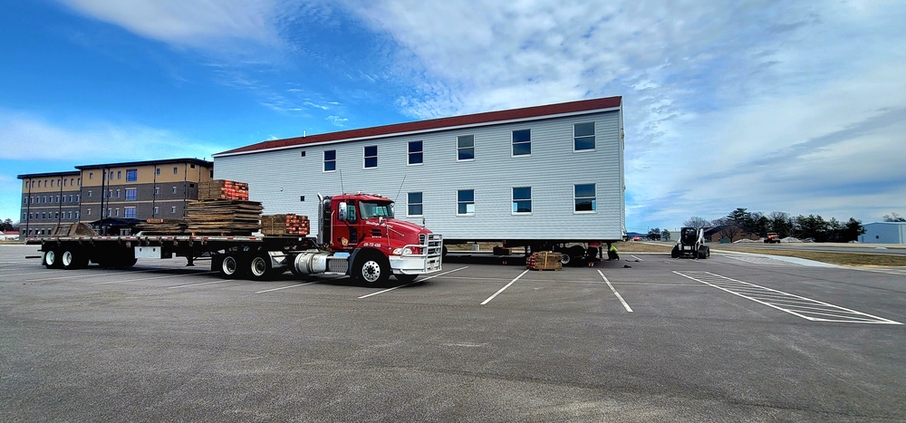 Contractors move third World War II-era barracks to new location