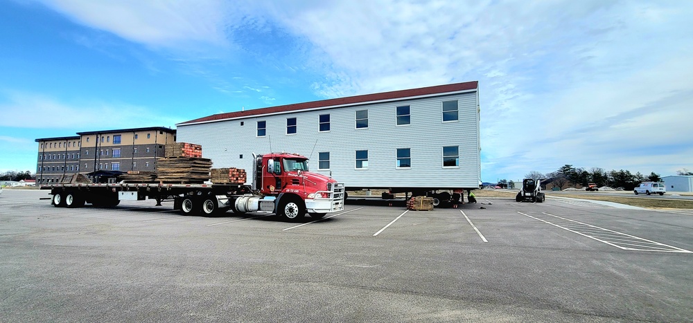 Contractors move third World War II-era barracks to new location