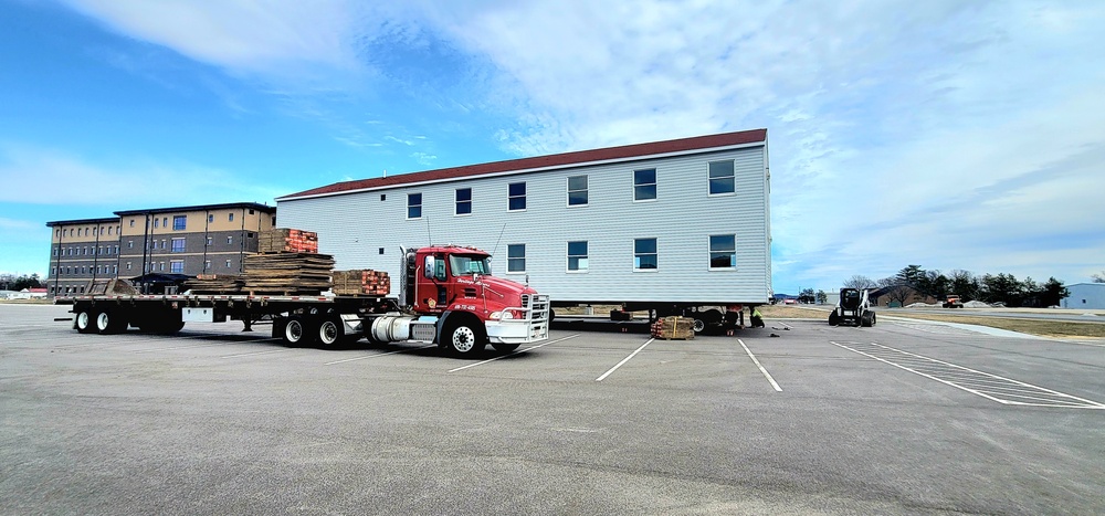 Contractors move third World War II-era barracks to new location