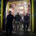 The Assistance Secretary of Defense tours a chilled warehouse on Guam