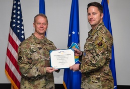 COMACC presents Distinguished Flying Cross to 363 ISRW Airman for extraordinary efforts