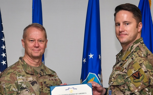 COMACC presents Distinguished Flying Cross to 363 ISRW Airman for extraordinary efforts