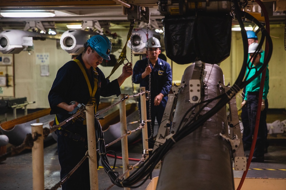 U.S. Sailor Lowers Jamming Pod