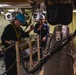 U.S. Sailor Lowers Jamming Pod