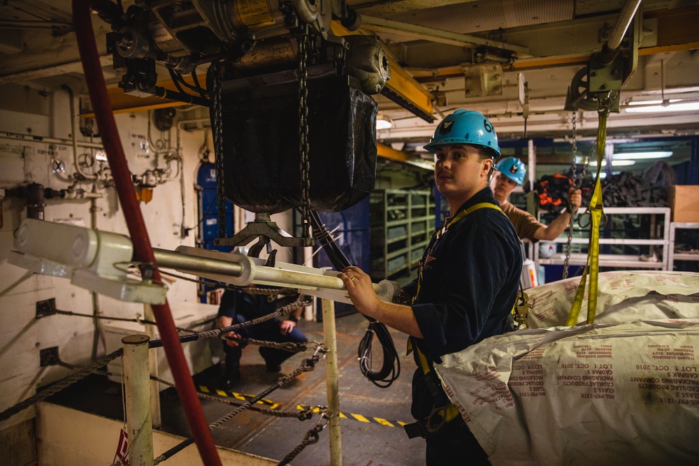 U.S. Sailor Lifts Jamming Pods