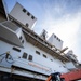 USS Tripoli Sailors Paint Hull