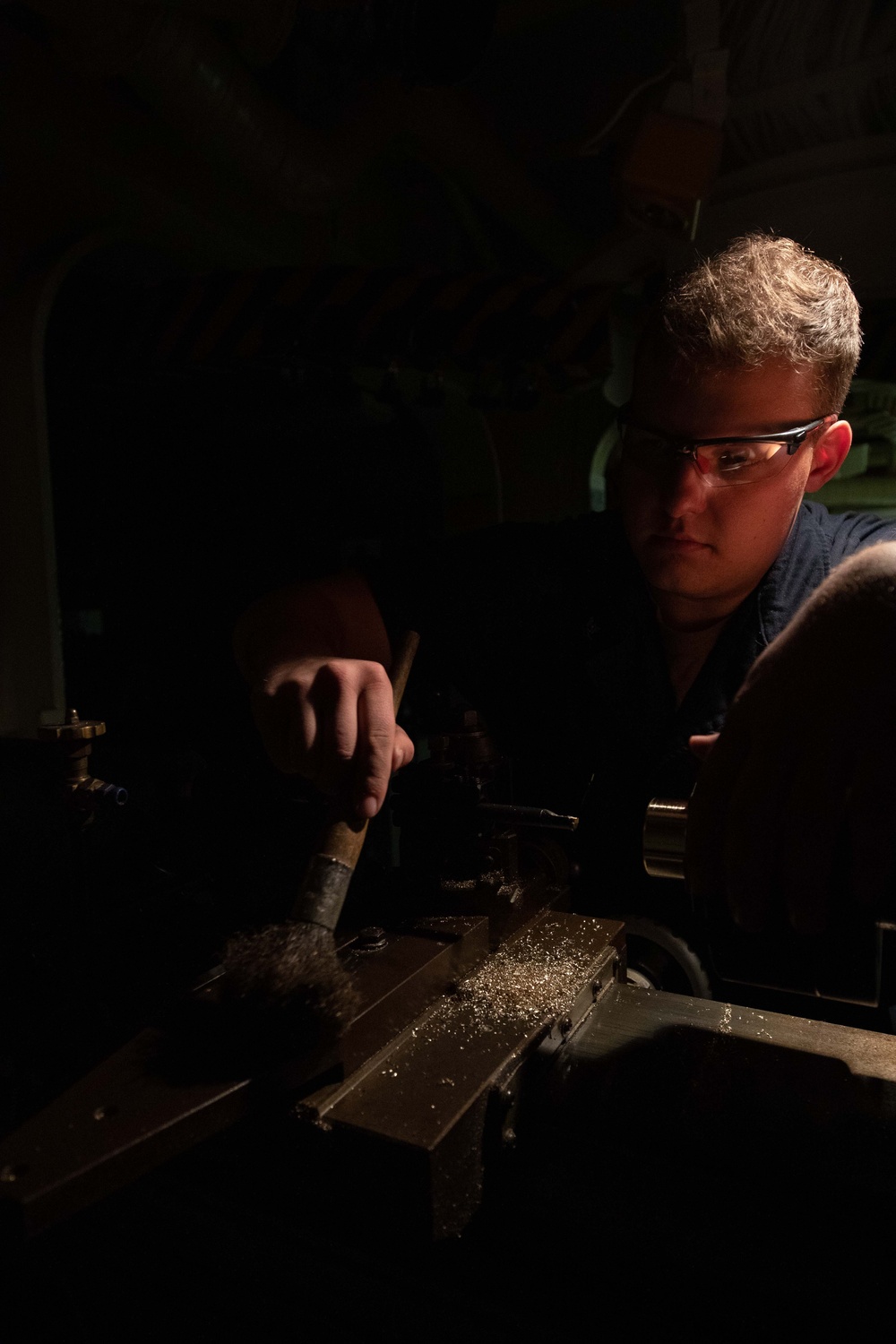 USS Tripoli Sailor Machines Parts During SRA