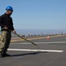 USS Tripoli Sailors Conduct Flight Deck Preservation During SRA