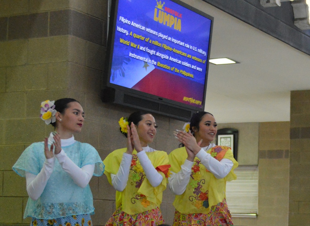 Dancers rehearse choreography as part of the Filipino-American Heritage Night at the Norfolk Tides stadium