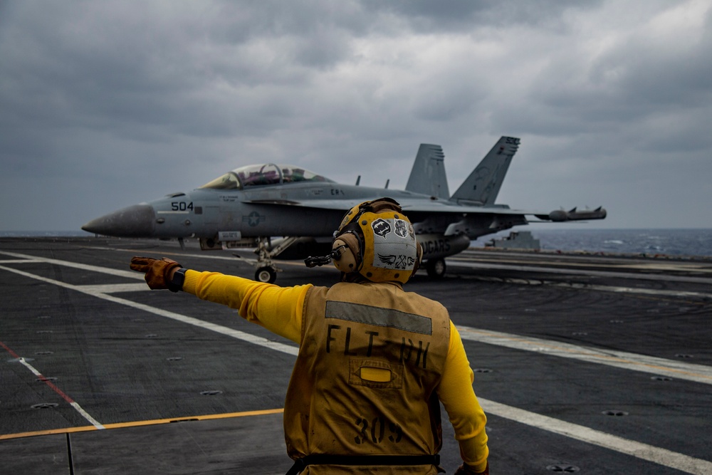 Sailor Directs Aircraft On The Flight Deck