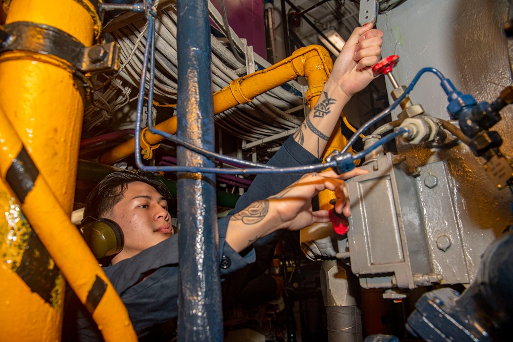 Sailor Performs Maintenance