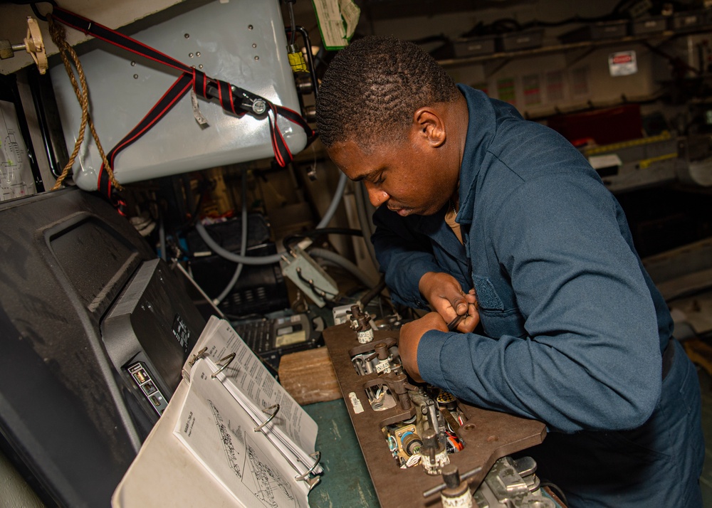 Sailor Performs Maintenance