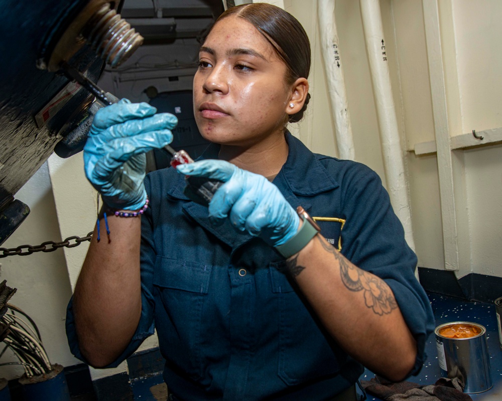 Sailor Removes Fittings From Armored Hatch