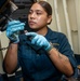 Sailor Removes Fittings From Armored Hatch