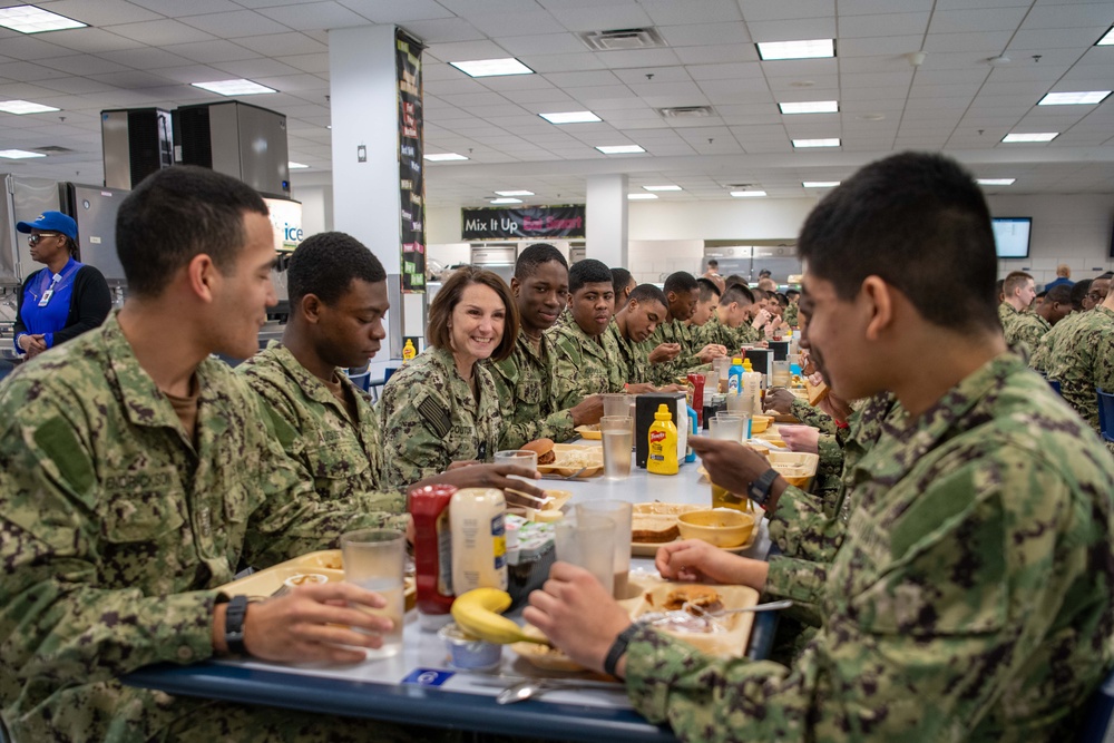 Rear Admiral Jennifer Couture eats lunch with recruits at Recruit Training Command