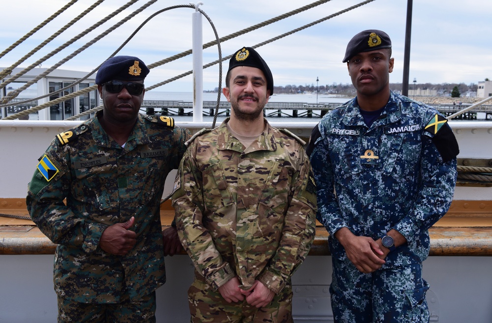 Foreign military partner members prepare to get underway aboard the USCGC Eagle