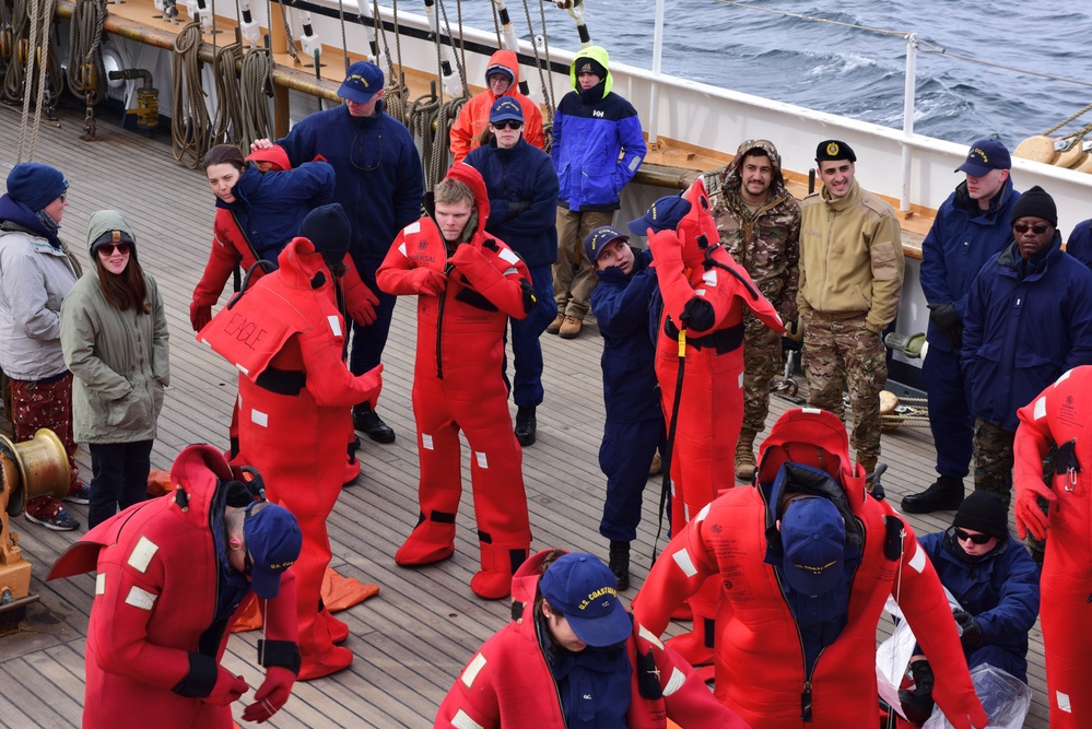 Coast Guard, National Oceanic and Atmospheric Administration officer candidates, foreign partners and Tall Ships America members learn survival skills aboard USCGC Eagle