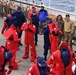 Coast Guard, National Oceanic and Atmospheric Administration officer candidates, foreign partners and Tall Ships America members learn survival skills aboard USCGC Eagle