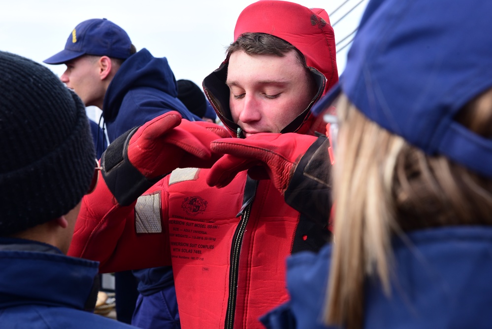 Coast Guard, National Oceanic and Atmospheric Administration Corps officer candidates, foreign partners and Tall Ships America members learn survival skills aboard USCGC Eagle