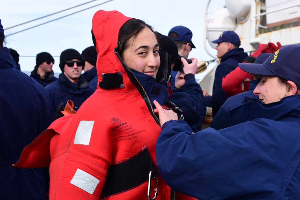 Coast Guard, National Oceanic and Atmospheric Administration Corps officer candidates, foreign partners and Tall Ships America members learn survival skills aboard USCGC Eagle