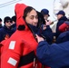 Coast Guard, National Oceanic and Atmospheric Administration Corps officer candidates, foreign partners and Tall Ships America members learn survival skills aboard USCGC Eagle