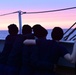 Coast Guard personnel aboard USCGC Eagle enjoy twilight while underway in the Atlantic Ocean