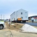 Continuing making history: Contractors move last two World War II-era barracks to new locations