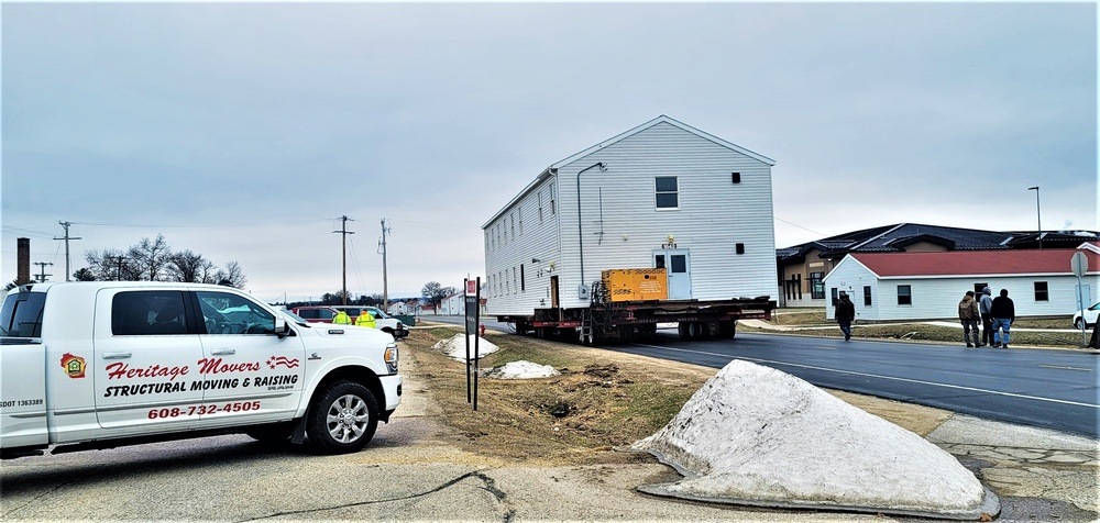 Continuing making history: Contractors move last two World War II-era barracks to new locations