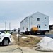 Continuing making history: Contractors move last two World War II-era barracks to new locations