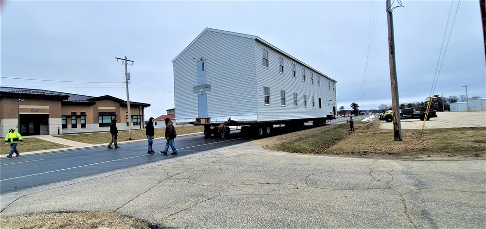 Continuing making history: Contractors move last two World War II-era barracks to new locations