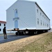 Continuing making history: Contractors move last two World War II-era barracks to new locations