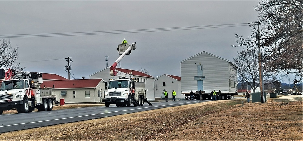 Continuing making history: Contractors move last two World War II-era barracks to new locations