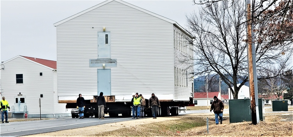 Continuing making history: Contractors move last two World War II-era barracks to new locations