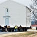 Continuing making history: Contractors move last two World War II-era barracks to new locations