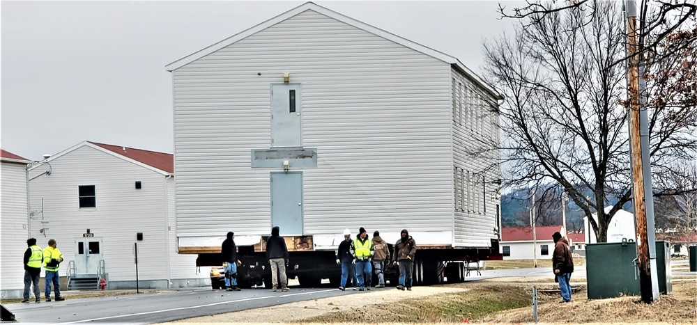 Continuing making history: Contractors move last two World War II-era barracks to new locations