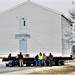 Continuing making history: Contractors move last two World War II-era barracks to new locations