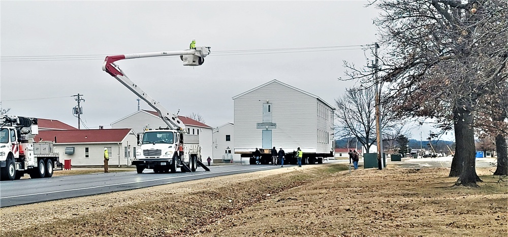 Continuing making history: Contractors move last two World War II-era barracks to new locations