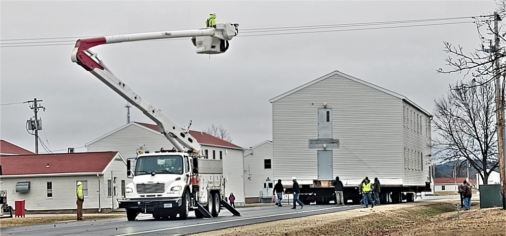 Continuing making history: Contractors move last two World War II-era barracks to new locations