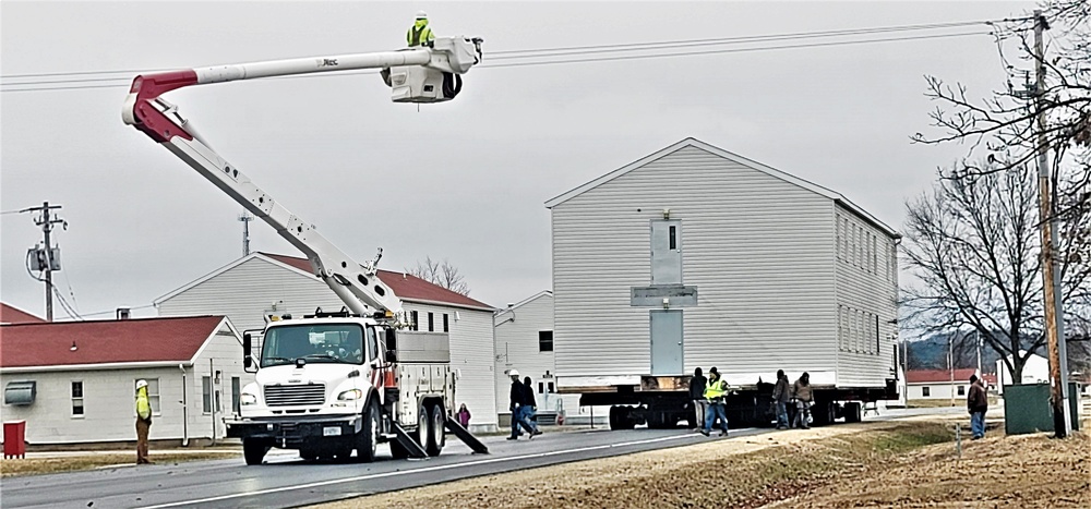 Continuing making history: Contractors move last two World War II-era barracks to new locations