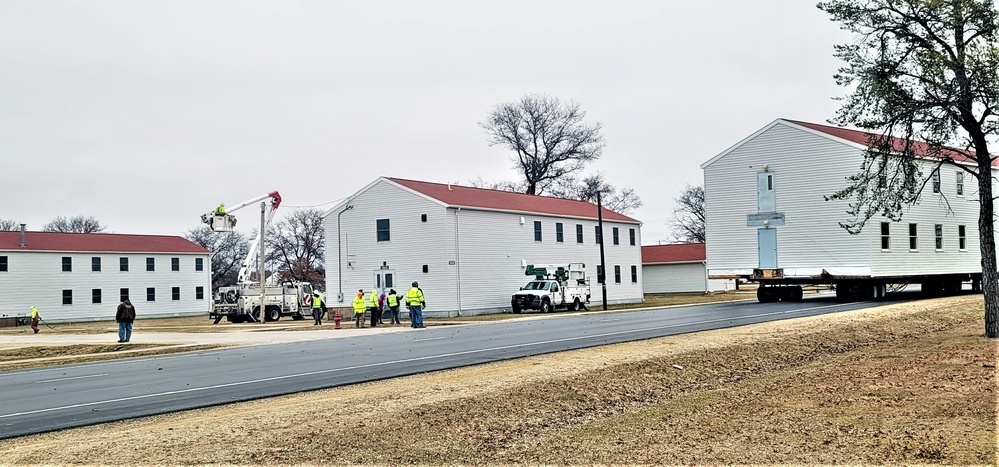 Continuing making history: Contractors move last two World War II-era barracks to new locations