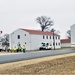 Continuing making history: Contractors move last two World War II-era barracks to new locations