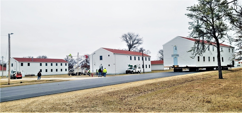 Continuing making history: Contractors move last two World War II-era barracks to new locations