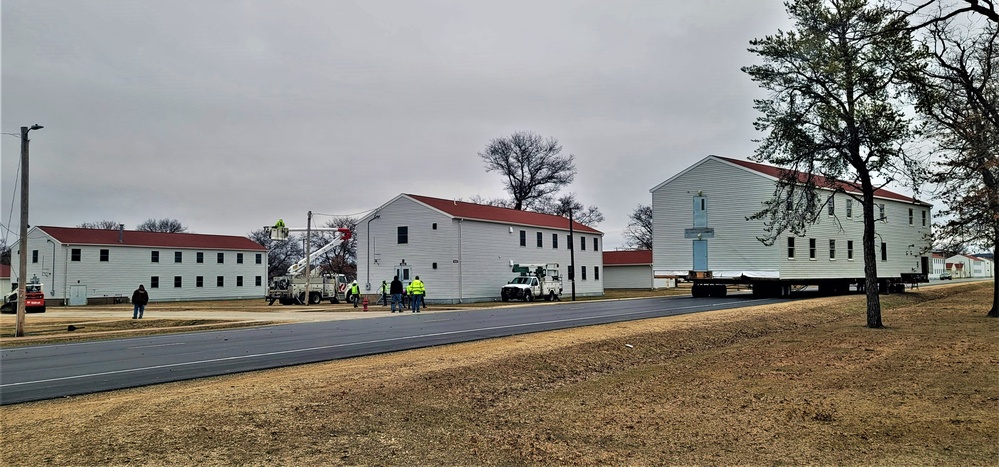 Continuing making history: Contractors move last two World War II-era barracks to new locations