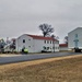 Continuing making history: Contractors move last two World War II-era barracks to new locations