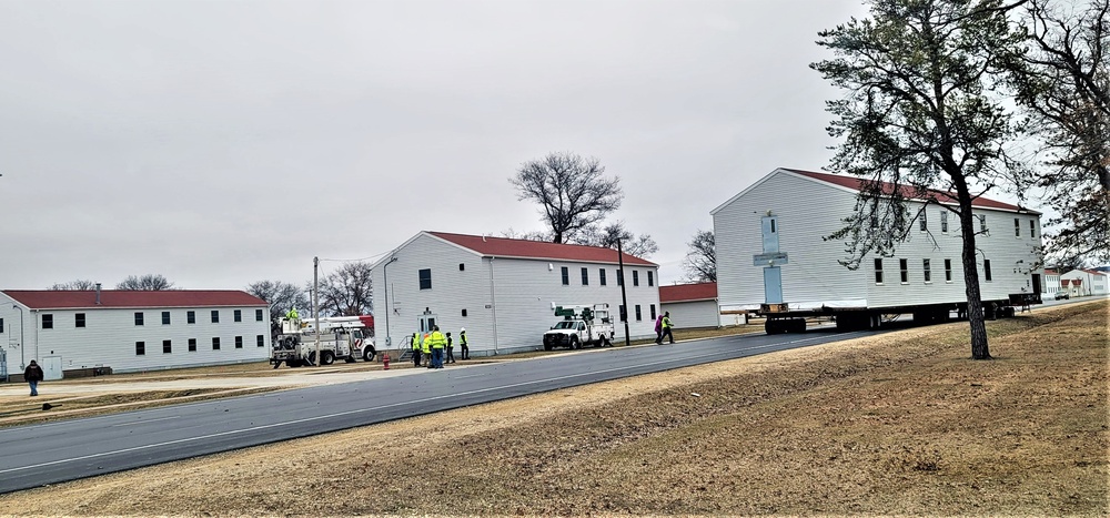 Continuing making history: Contractors move last two World War II-era barracks to new locations