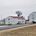 Continuing making history: Contractors move last two World War II-era barracks to new locations