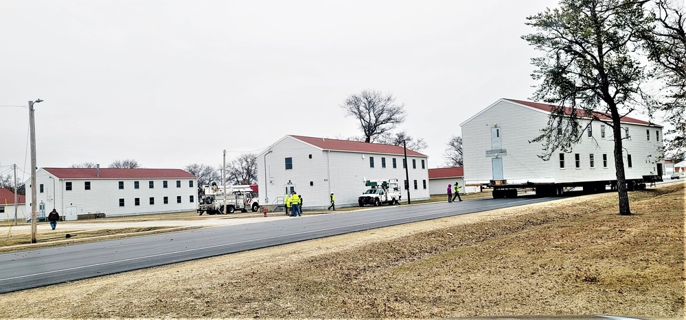 Continuing making history: Contractors move last two World War II-era barracks to new locations